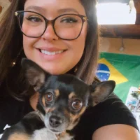 Professional pet grooming team members bathing and styling dogs at mobile grooming station